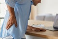 Man feeling severe backache from long sedentary work at the computer in the office. Bad posture Royalty Free Stock Photo