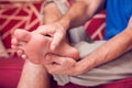 Man feels strong foot pain. People, medicine and healtcare concept