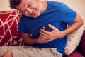 Man feels strong heart pain. People, healthcare and medicine concept