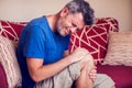 Man feels strong knee pain. People, medicine and healtcare concept