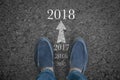 Man feet on asphalt road with start new year 2018 Royalty Free Stock Photo