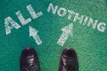 Man feet in leather shoes standing before text with choice all or nothing painted on asphalt, top view