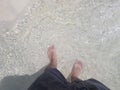 Man feet close-up standing on beach Royalty Free Stock Photo