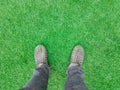 man feet stand on the green artificial grass Royalty Free Stock Photo