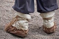 Man feet in national Russian leather shoes postol