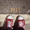 Man feet and number 2017, as the new year