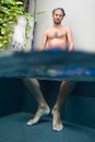 Man with feet in pool Royalty Free Stock Photo