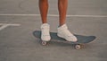 Man feet riding skate city street closeup. Active hipster balancing longboard Royalty Free Stock Photo
