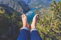Man feet selfie on the top of the hill enjoying the view on river or lake canyon. Freedom concept