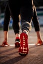 Man feet in starting position for running on race track in stadium Royalty Free Stock Photo