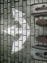 Man feet in suede boots. Vintage suitcases stand on paving stone road. White arrows point  three different directions. Royalty Free Stock Photo