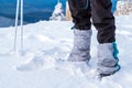 Man feet tourist protection trekking mountain snow winter sky blue equipment hiking Royalty Free Stock Photo