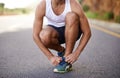 Man, feet and tying laces on road for running, prepare and shoes for cardio or training for marathon. Male person, legs Royalty Free Stock Photo