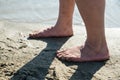 Man feets on the beach