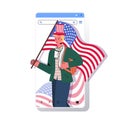 Man in festive hat holding usa flag celebrating 4th of july american independence day concept Royalty Free Stock Photo