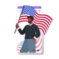 Man in festive hat holding usa flag celebrating 4th of july american independence day concept Royalty Free Stock Photo