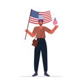 Man in festive hat holding usa flag guy celebrating 4th of july american independence day concept Royalty Free Stock Photo