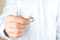 Engagement / marriage / wedding proposal scene. Close up of man handing the expensive gold platinum diamond ring to his bride. Royalty Free Stock Photo