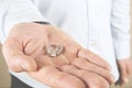 Engagement / marriage / wedding proposal scene. Close up of man handing the expensive gold platinum diamond ring to his bride. Royalty Free Stock Photo