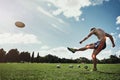 Man, field and kick rugby ball for sport with red glow, knee and injury on grass with pain for fitness. Athlete guy Royalty Free Stock Photo