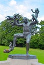 Man fighting babies statue Royalty Free Stock Photo