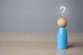 Man figurine with a question mark above his head. FAQ. Royalty Free Stock Photo