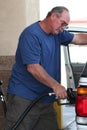 Man filling expensive gas tank Royalty Free Stock Photo