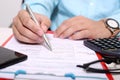 Man is filling form with pen. Picture of form on the clipboard Royalty Free Stock Photo