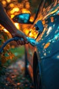 A man filling his car with gasoline at a fuel station