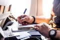 Man filling in immigration form sitting at airplane