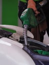 Man filling petrol into a motercycle Royalty Free Stock Photo