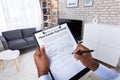 Man Filling Real Estate Appraisal Form