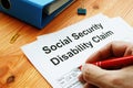 Man filling in Social Security Disability Claim