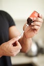 Man, filling a syringe or liquid injection of testosterone and bottle, steroids and closeup of bodybuilder hands