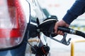 Man is filling tank of his car on the gas station