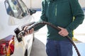 Man filling up with cng compressed natural gas in his car