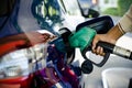 Man filling up gas in his car