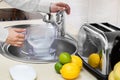 Man fills filter jug Royalty Free Stock Photo