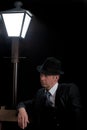 Man Film noir man lamppost bench Royalty Free Stock Photo