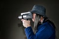 Man filming with vintage movie camera Royalty Free Stock Photo