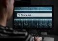 Man finding for a job on computer