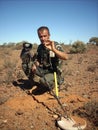 Man finding a small gold nugget