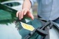 Man finding parking ticket fine on his car Royalty Free Stock Photo