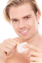 Man with finger in creme Royalty Free Stock Photo