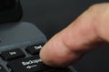 Man finger pressing backspace button of computer keyboard