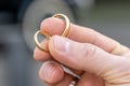 In man fingers are two wedding rings Wedding tradition Gold rings Royalty Free Stock Photo