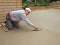 Man finishing concrete slab Royalty Free Stock Photo