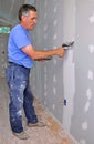 Man finishing drywall