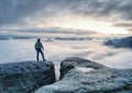 Man finnaly standing on rock and enjoy foggy mountain view Royalty Free Stock Photo