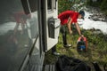 Man Firing Up Gas Powered Portable Inverter Generator To Hook Up His Camper Van Royalty Free Stock Photo